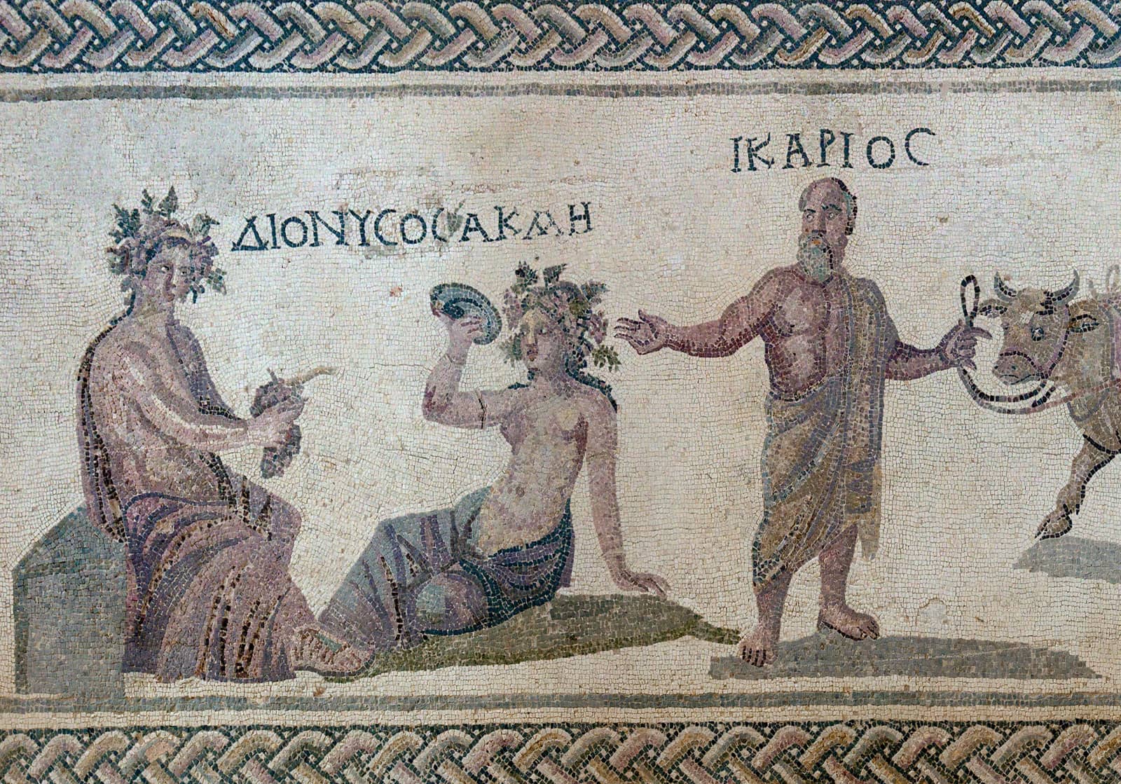Roman floor mosaic in the House of Dionysus, Paphos: Dionysus and the nymph Akme beside Ikarios leading an ox, with their names in Greek letters